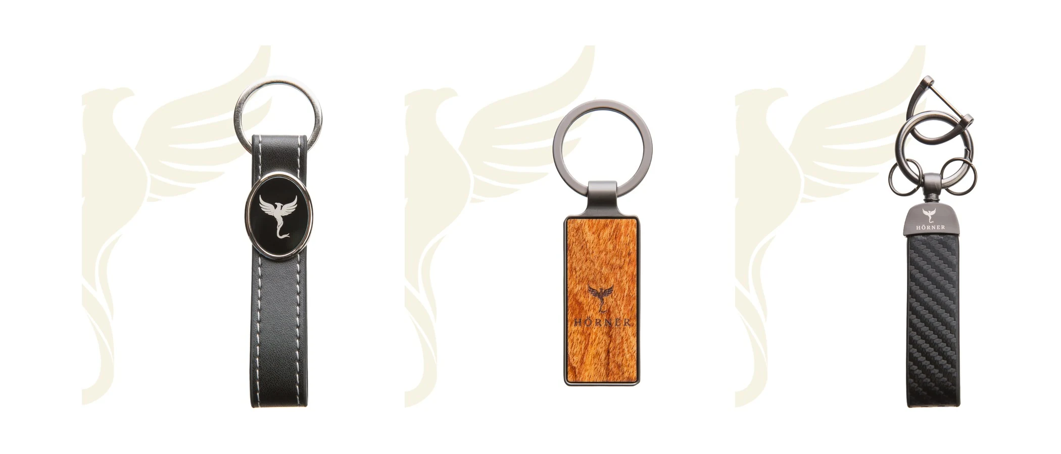 Three engraved Hörner keyrings in leather, rosewood and carbon look