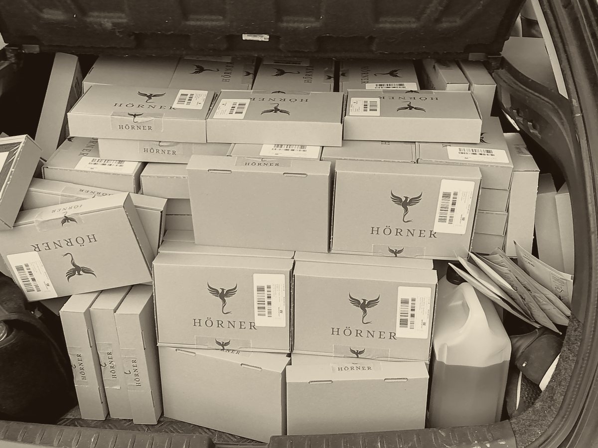 A car boot packed with Hörner shipping boxes